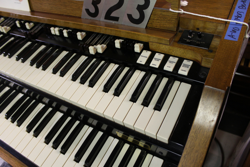 454 is a Hammond A-205 in a walnut finish equipped with a transposer, built-in speakers, and has an output for MIDI! Serial #01010285