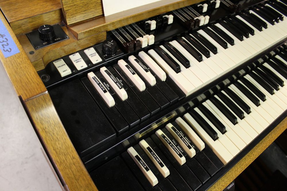 454 is a Hammond A-205 in a walnut finish equipped with a transposer, built-in speakers, and has an output for MIDI! Serial #01010285