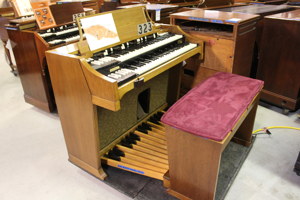 454 is a Hammond A-205 in a walnut finish equipped with a transposer, built-in speakers, and has an output for MIDI! Serial #01010285