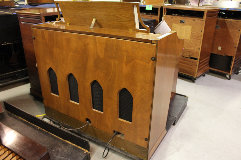 454 is a Hammond A-205 in a walnut finish equipped with a transposer, built-in speakers, and has an output for MIDI! Serial #01010285