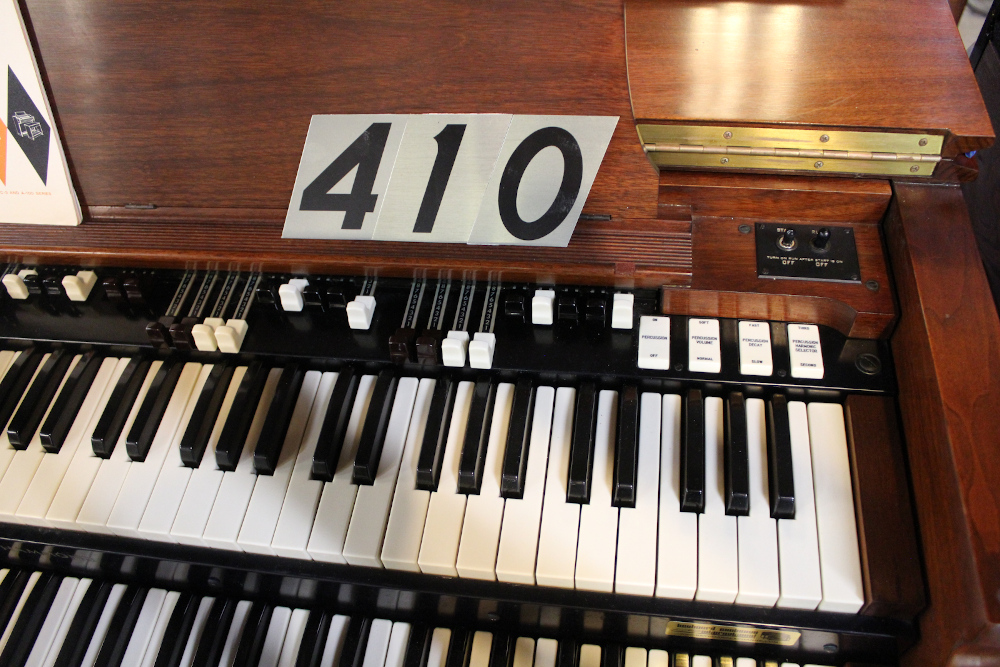 410 is a 1959 Hammond B-3 in a walnut finish.