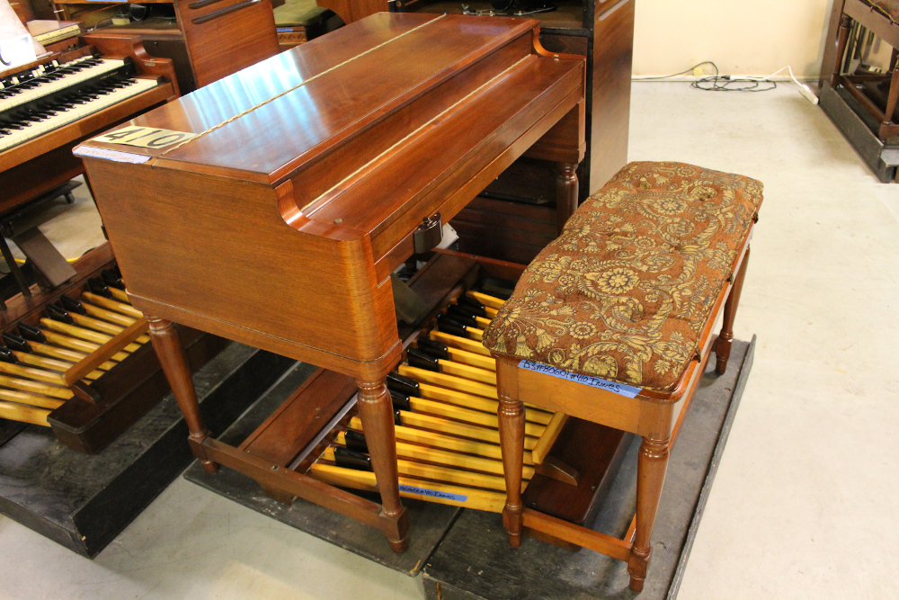 410 is a 1959 Hammond B-3 in a walnut finish.