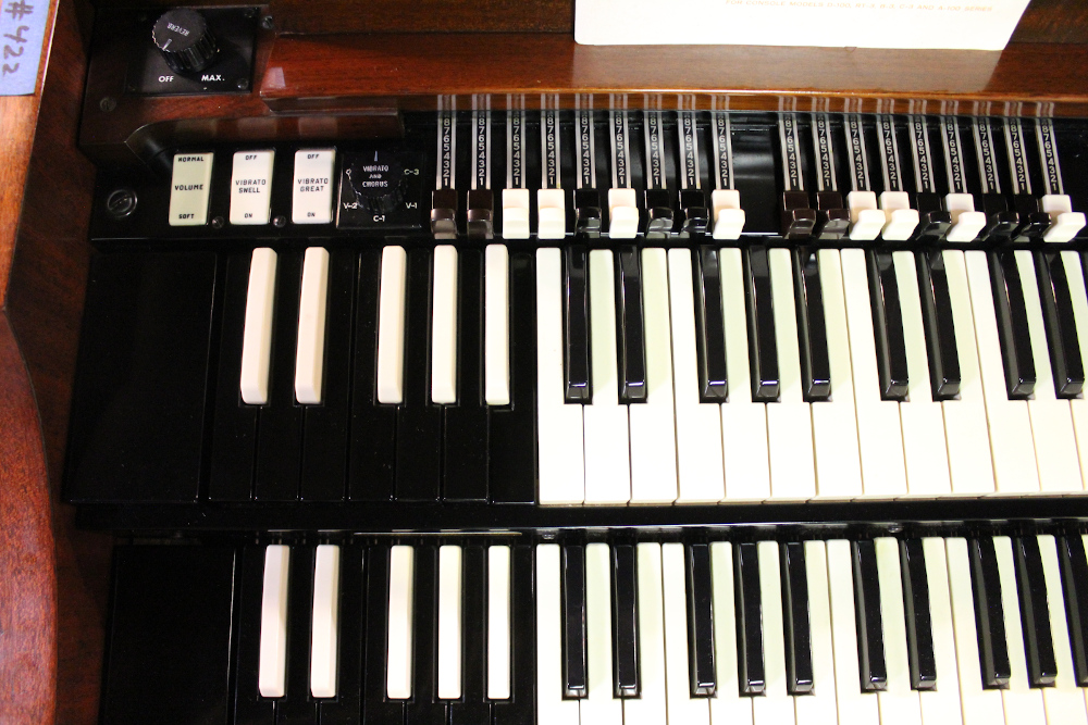 422 is a 1963 Hammond A100 in a mahogany finish..