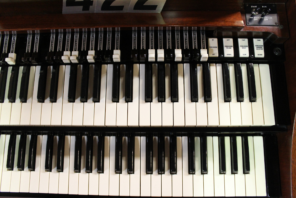 422 is a 1963 Hammond A-100 in a mahogany finish.