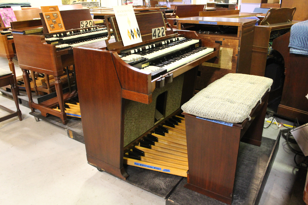 422 is a 1963 Hammond A100 in a mahogany finish.