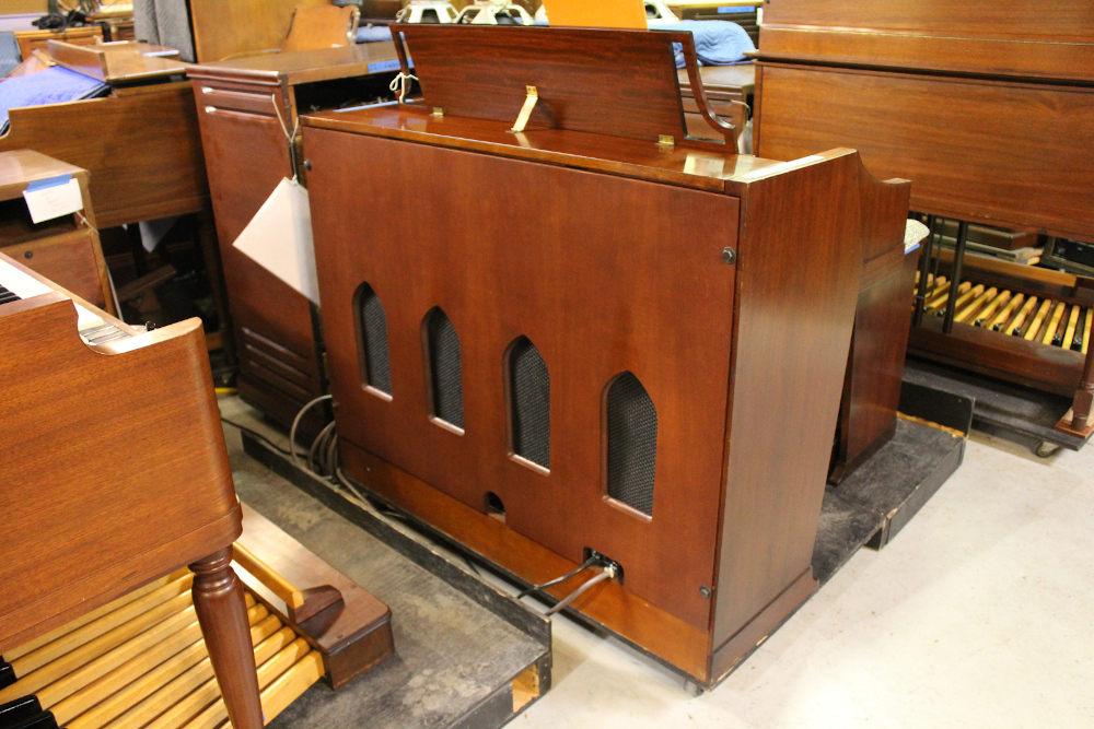 422 is a 1963 Hammond A-100 in a mahogany finish.