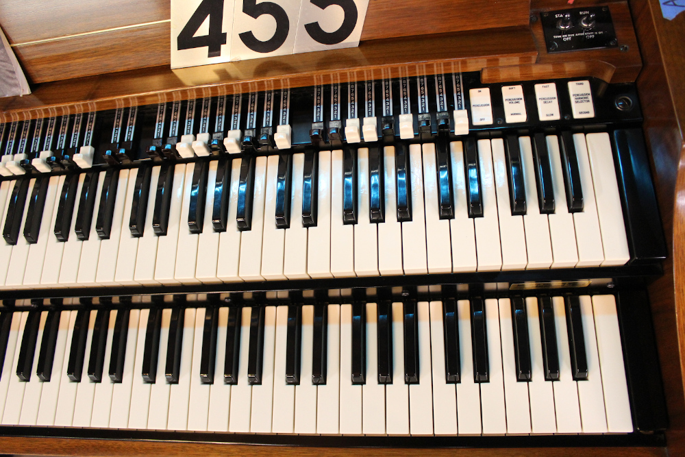 455 is a 1963 Hammond A-100 in a mahogany finish.
