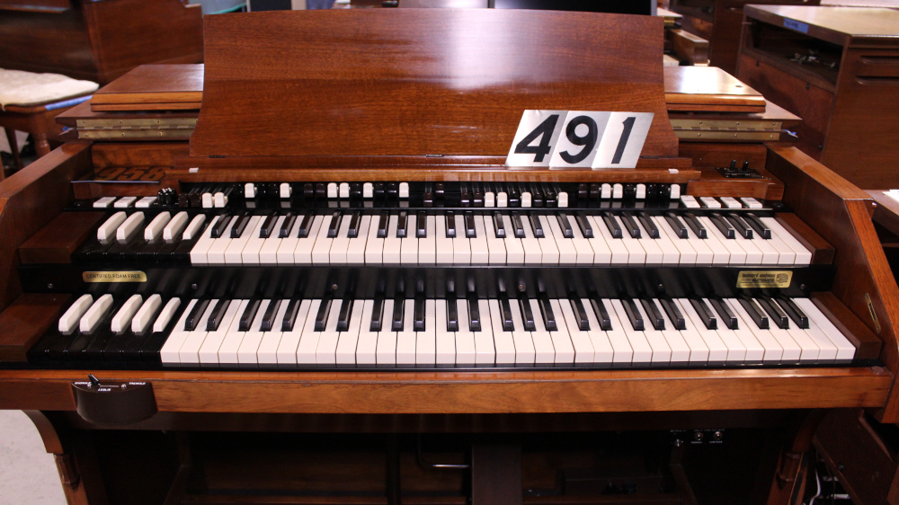 491 is a 1958 C3 in a Walnut finish.  Serial #72913