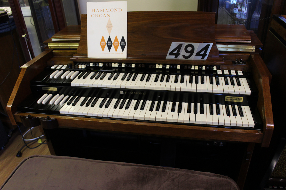 494 is a 1969 Hammond C3 in a walnut finish with engraved drawbars in mint condition! Serial #A-24339