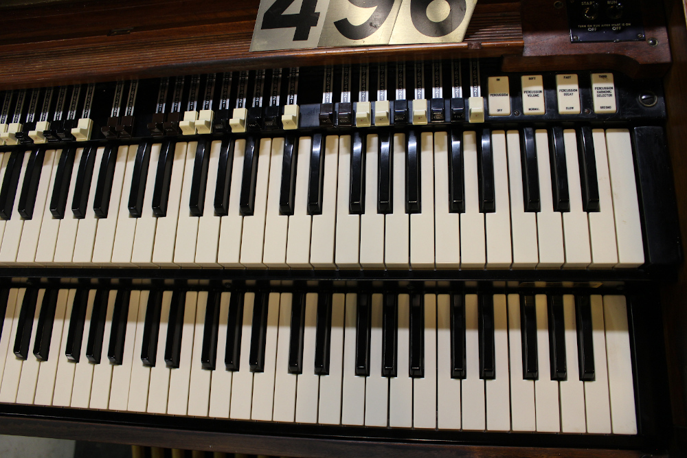 496 is a 1971 Hammond B-3 in a walnut finish.. 