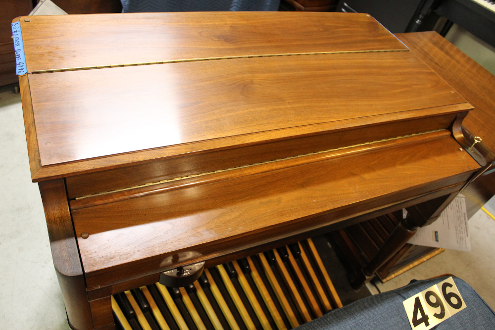 496 is a 1971 Hammond B-3 in a walnut finish.. 
