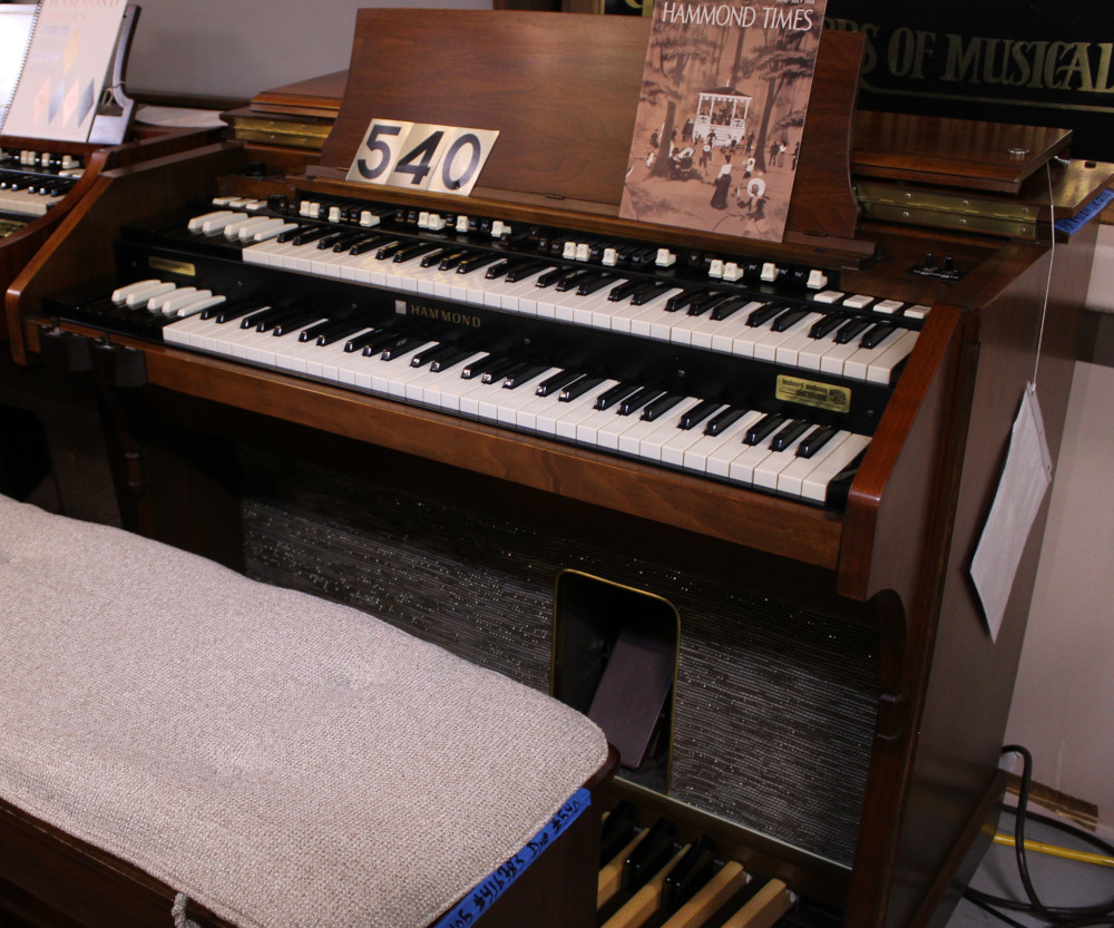 540 is a Hammond A105 in a Walnut finish.