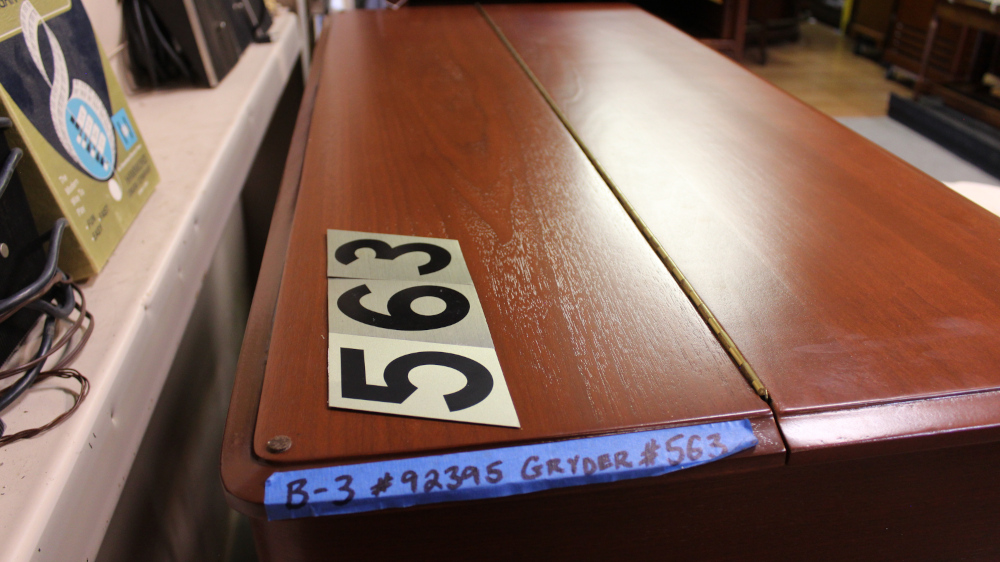 563 is a Hammond B3 in a Walnut finish.  Serial #92395