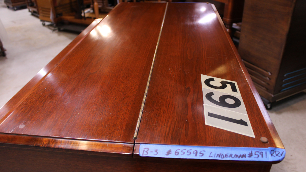 591 is a 1957 Hammond B3 in a Walnut finish.