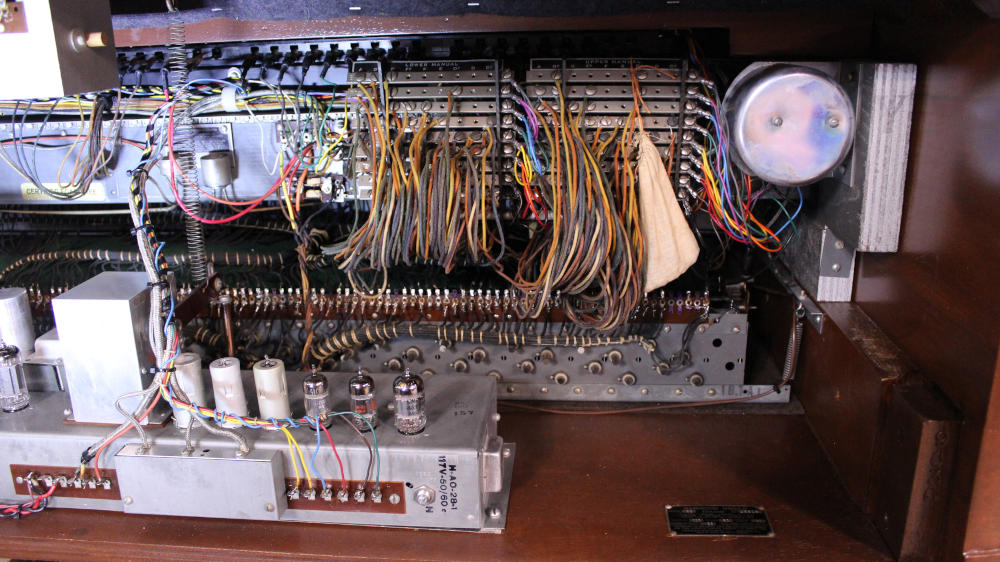 615 is a 1952 Hammond B2 converted to a B3 in a walnut finish.  Serial #45915