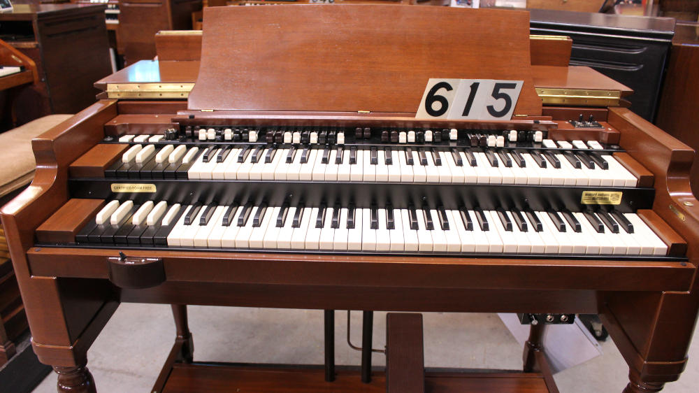 615 is a 1952 Hammond B2 converted to a B3 in a walnut finish.  Serial #45915