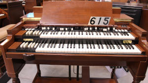615 is a 1952 Hammond B2 converted to a B3 in a walnut finish for sale!
