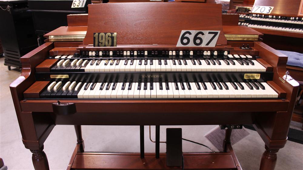 667 is a 1961 Hammond B3 organ in a walnut finish for sale at Keyboard Exchange International