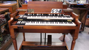 694 is a 1959 Hammond B3 in a walnut finish for sale!